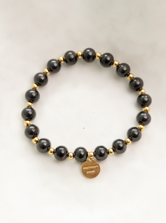 Pulsera elástica con cuentas negras y doradas en acero inoxidable 316